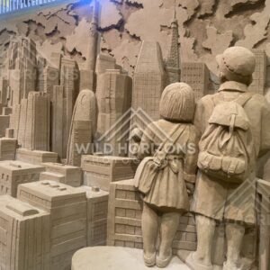 Sand Sculpture of Children Watching a Towering City Skyline. Tottori Sand Museum, Japan