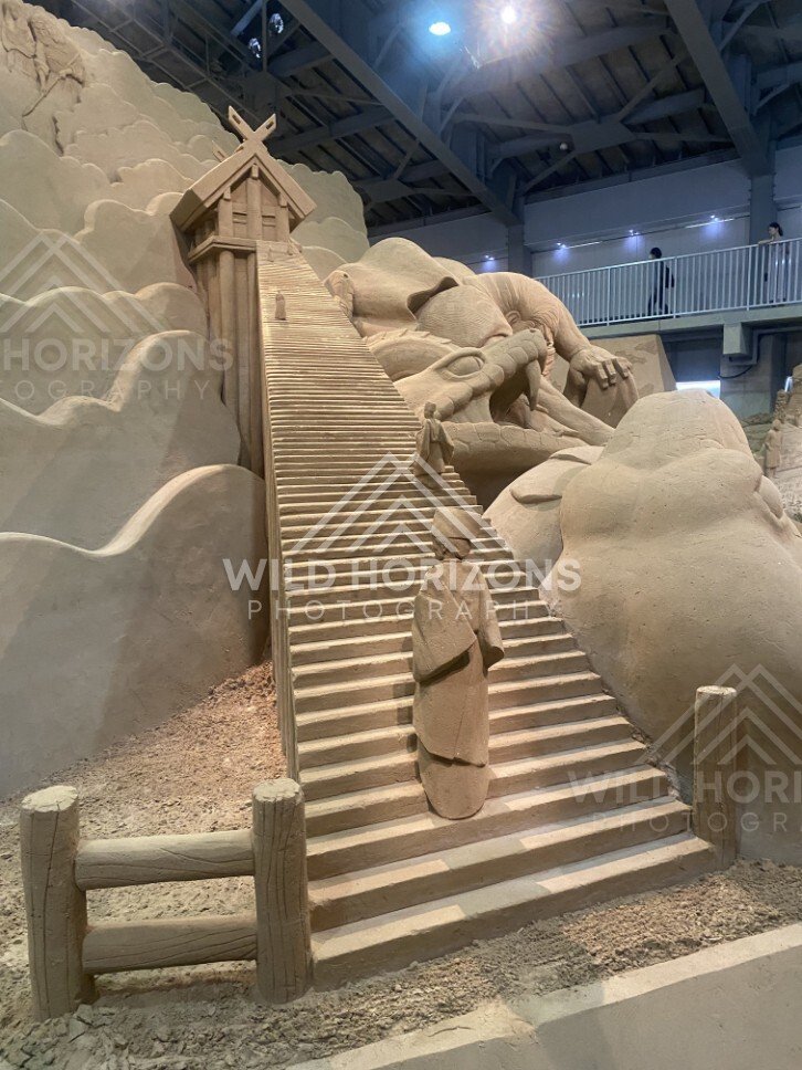 Giant Stairway Sand Sculpture Leading to a Small Shrine in the Clouds. Tottori Sand Museum, Japan