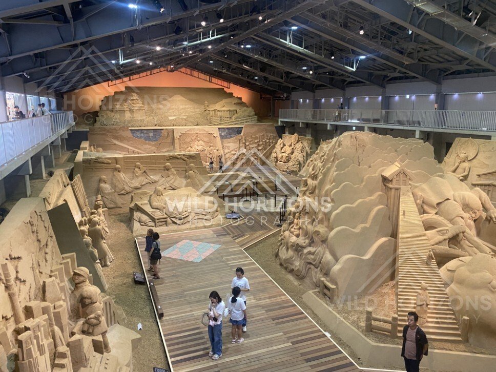 Wide View of the Tottori Sand Museum Exhibition Hall with Monumental Sculptures. Tottori Sand Museum, Japan