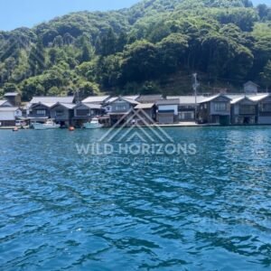 Fishing boats and buoys floating in front of the famous funaya row. Ine, Japan