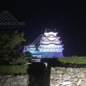 Close-Up of the Illuminated Keep of Himeji Castle at Night. Himeji Castle, Japan.
