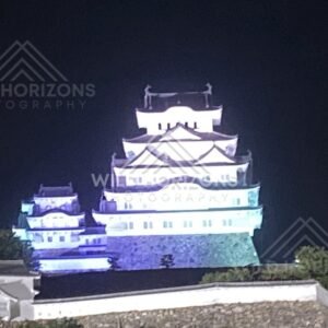 Floodlit Himeji Castle Keep Rising Above White Plaster Walls. Himeji Castle, Japan.