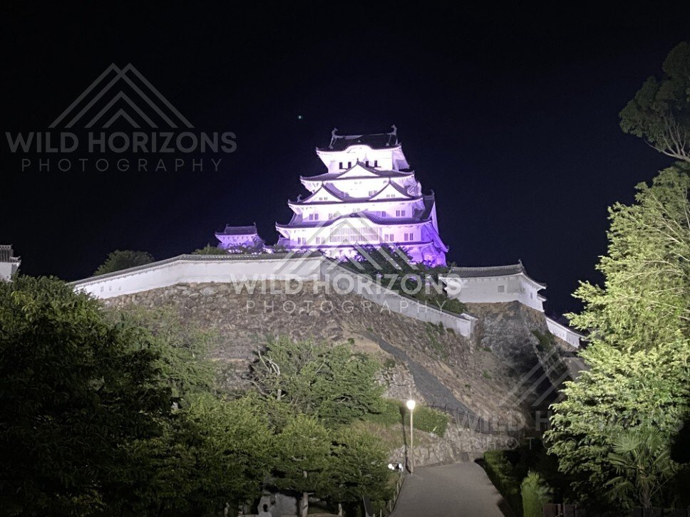 Himeji Castle Overlooking Stone Ramparts and Night Pathways. Himeji Castle, Japan.