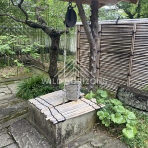 Traditional Bamboo Well and Stone Basin in Koko-en Garden. Himeji, Japan.