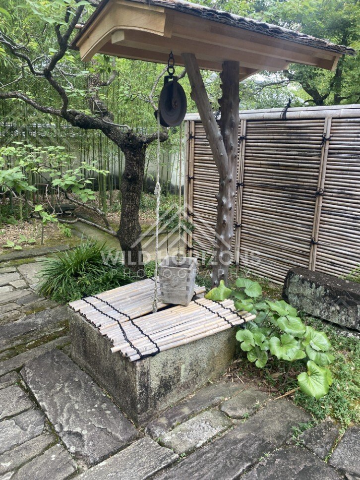 Traditional Bamboo Well and Stone Basin in Koko-en Garden. Himeji, Japan.