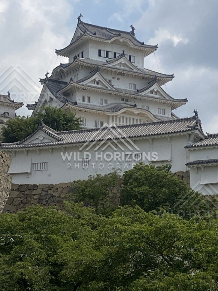 Upper Keep of Himeji Castle Above White Walls. Himeji, Japan.