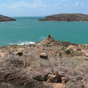 Stone cairn overlooking the Torres Strait from Cape York. Seisia, Australia.