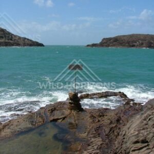 Northernmost point sign beside rock pools at the edge of Australia. Seisia, Australia.