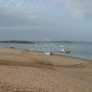 Small boats resting on sandy shoreline at Seisia. Seisia, Australia.