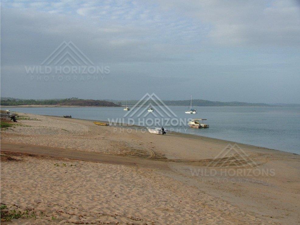 Small boats resting on sandy shoreline at Seisia. Seisia, Australia.