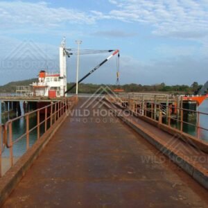 Industrial crane and loading jetty at Seisia Wharf. Seisia, Australia.