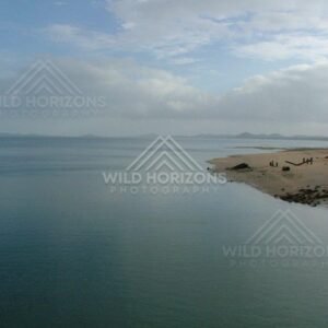 Quiet shoreline beside waterfront building at Seisia. Seisia, Australia.