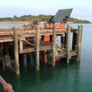 Solar-powered equipment on timber pylons at Seisia Wharf. Seisia, Australia.