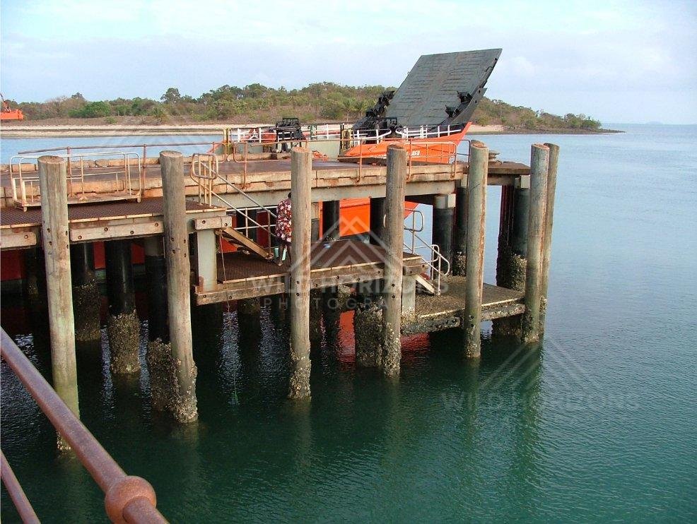Solar-powered equipment on timber pylons at Seisia Wharf. Seisia, Australia.