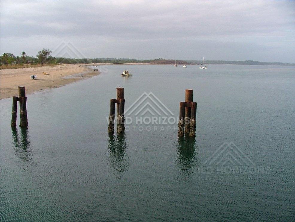 Anchored boats across a sheltered bay at Seisia. Seisia, Australia.