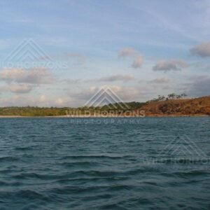Open coastal waters facing low hills near Seisia. Seisia, Australia.