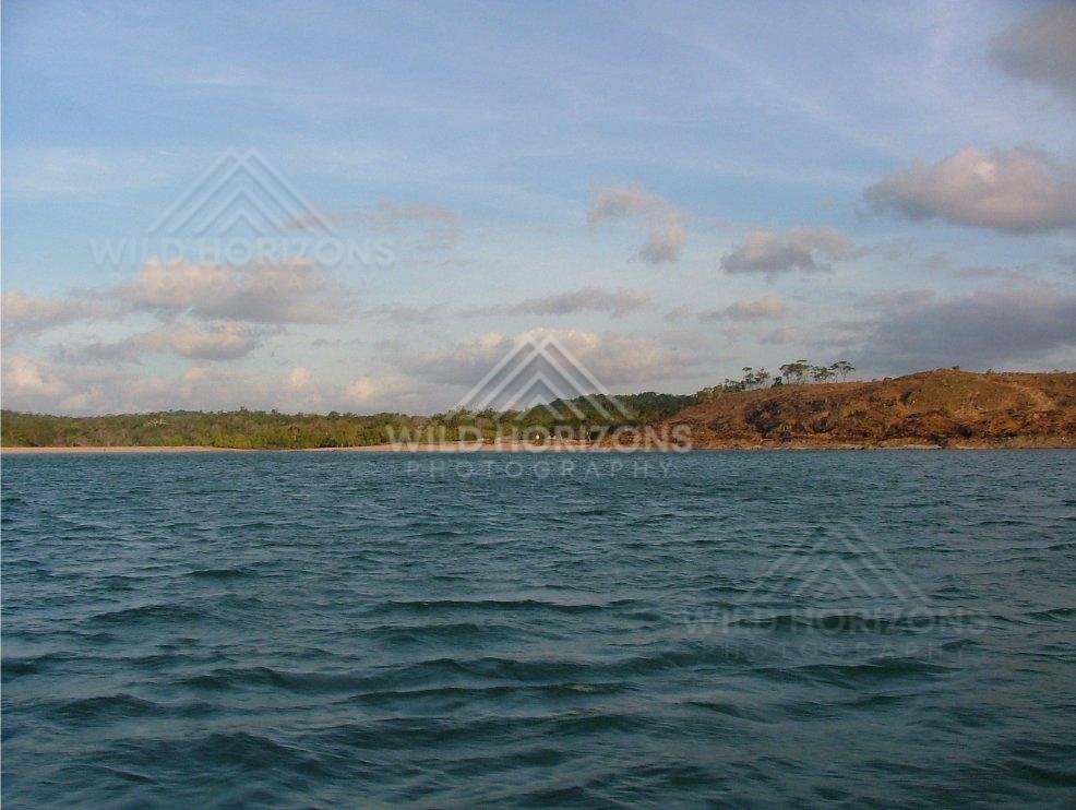 Open coastal waters facing low hills near Seisia. Seisia, Australia.