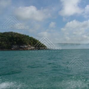 Forested headland viewed from coastal waters near Seisia. Seisia, Australia.