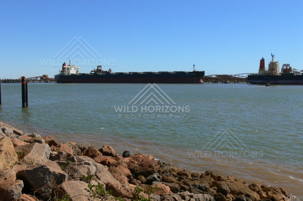Iron-ore bulk carrier berthed at Port Hedland harbour. Pilbara, Australia.