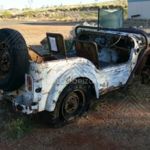 Abandoned 1950s Austin Champ military vehicle in an outback yard. Pilbara, Australia.