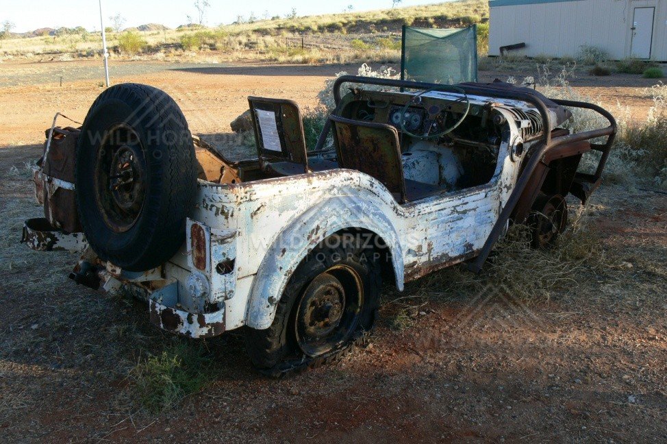 Abandoned 1950s Austin Champ military vehicle in an outback yard. Pilbara, Australia.