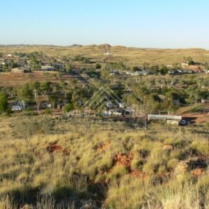 Remote Pilbara township surrounded by spinifex hills. Pilbara, Australia.