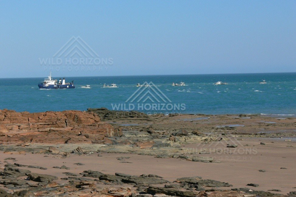 Recreational fishing boats near the jetty on the Indian Ocean. Derby, Western Australia, Australia.