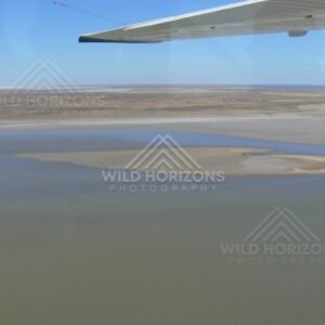Expansive lake waters fading into salt horizons. Lake Eyre Basin, Australia.