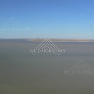 Isolated sand island within inland lake waters. Lake Eyre Basin, Australia.