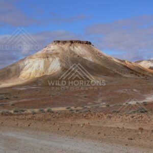 Close view of a cream and ochre Breakaways butte beside the Stuart Highway approach. Kanku-Breakaways Conservation Park/Coober Pedy, Australia.
