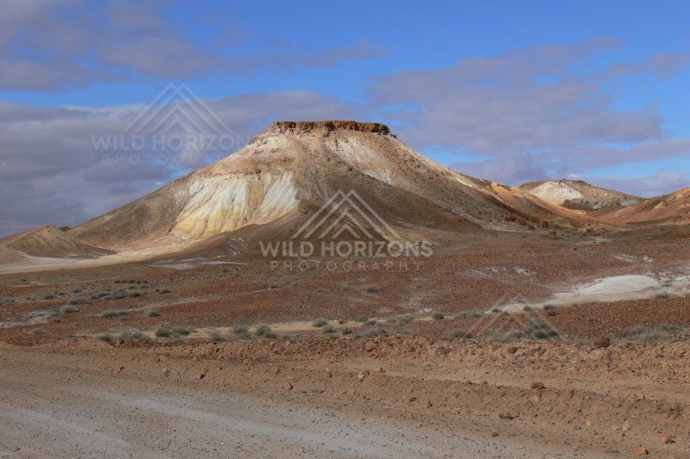 Close view of a cream and ochre Breakaways butte beside the Stuart Highway approach. Kanku-Breakaways Conservation Park/Coober Pedy, Australia.