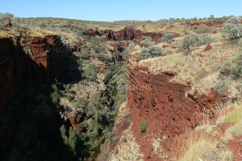 Lookout over a red rock gorge system in Karijini. Pilbara, Australia.