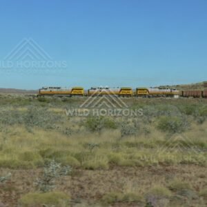 Iron-ore train departing the Pilbara near Tom Price. Pilbara, Australia.