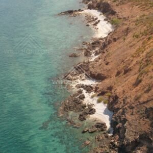 Aerial view of rocky Cape York coastline with turquoise water. Torres Strait, Queensland, Australia.
