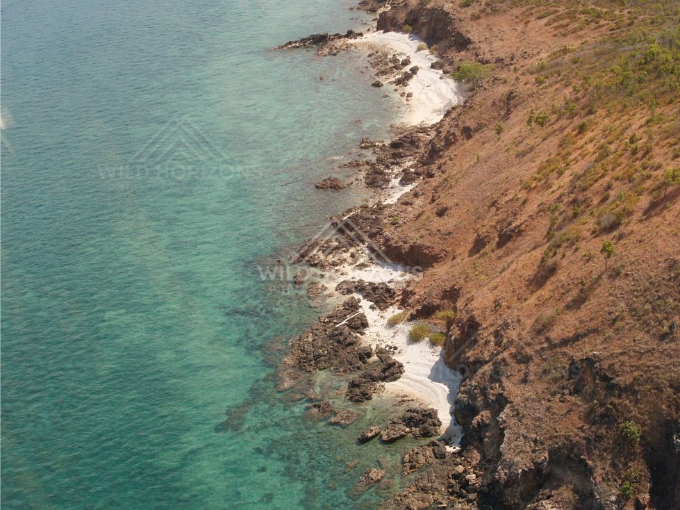 Aerial view of rocky Cape York coastline with turquoise water. Torres Strait, Queensland, Australia.