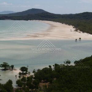 Sweeping sand flats and inlet with forested hills beyond. Cape York, Queensland, Australia.