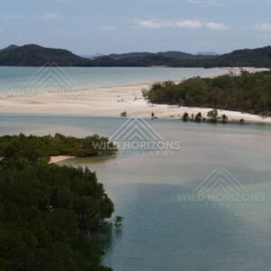 Sandy lagoon and forested peninsula from the air. Cape York, Queensland, Australia.