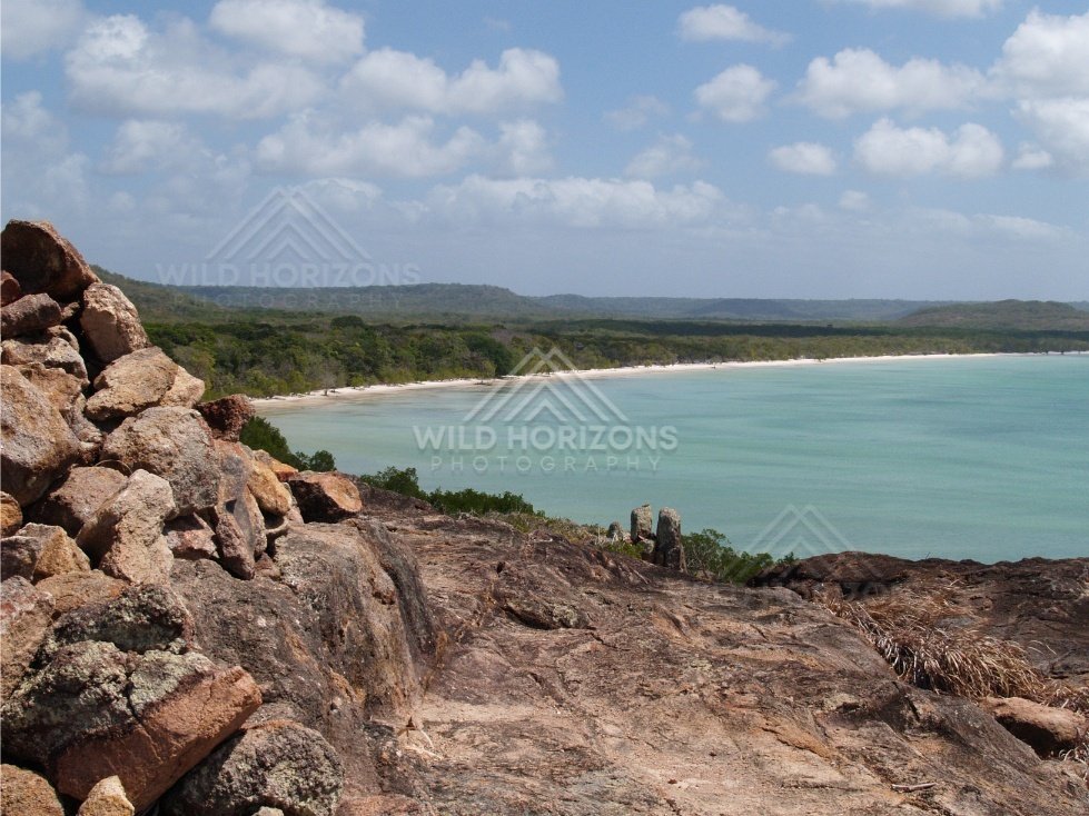 Textured Rock Foreground Overlooking a Broad Tropical Bay and Sandy Shoreline. Cape York, Australia.