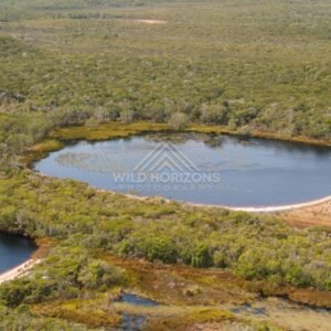 Circular lagoon within coastal heath. Narau Beach, Queensland, Australia.
