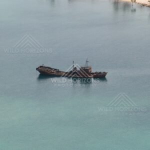 Coastal vessel at anchor in clear water. Seisia, Queensland, Australia.