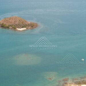 Small island in turquoise shallows. Seisia, Queensland, Australia.