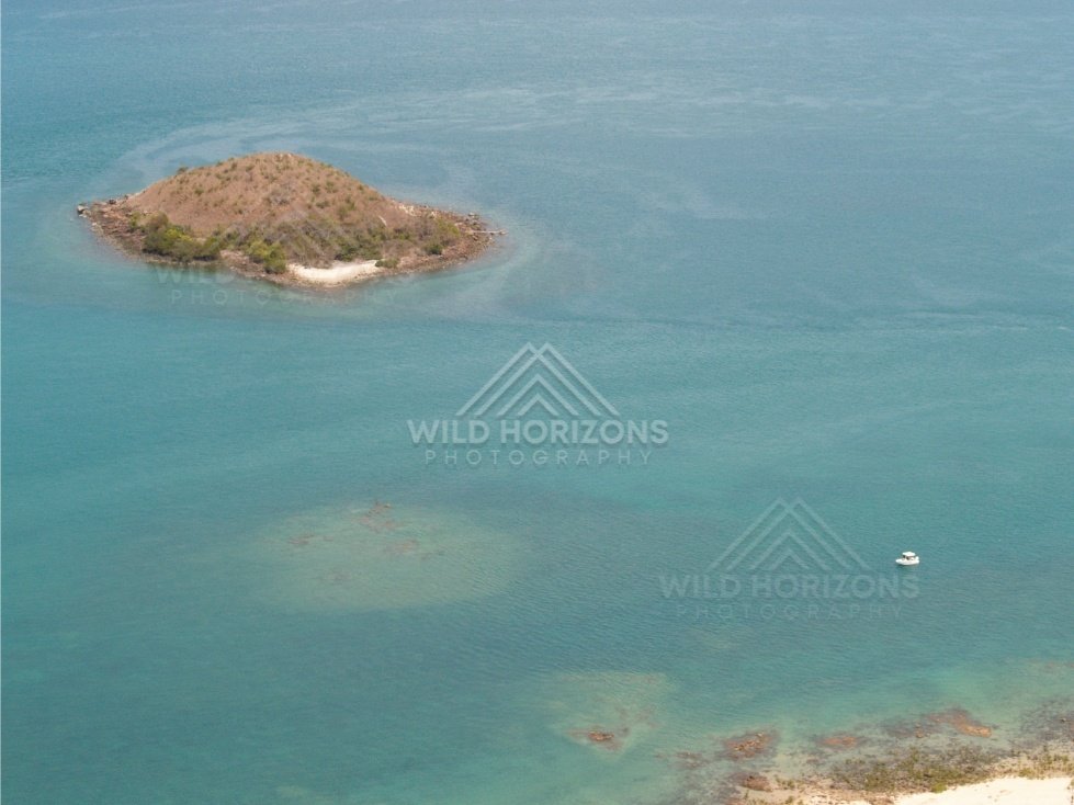 Small island in turquoise shallows. Seisia, Queensland, Australia.