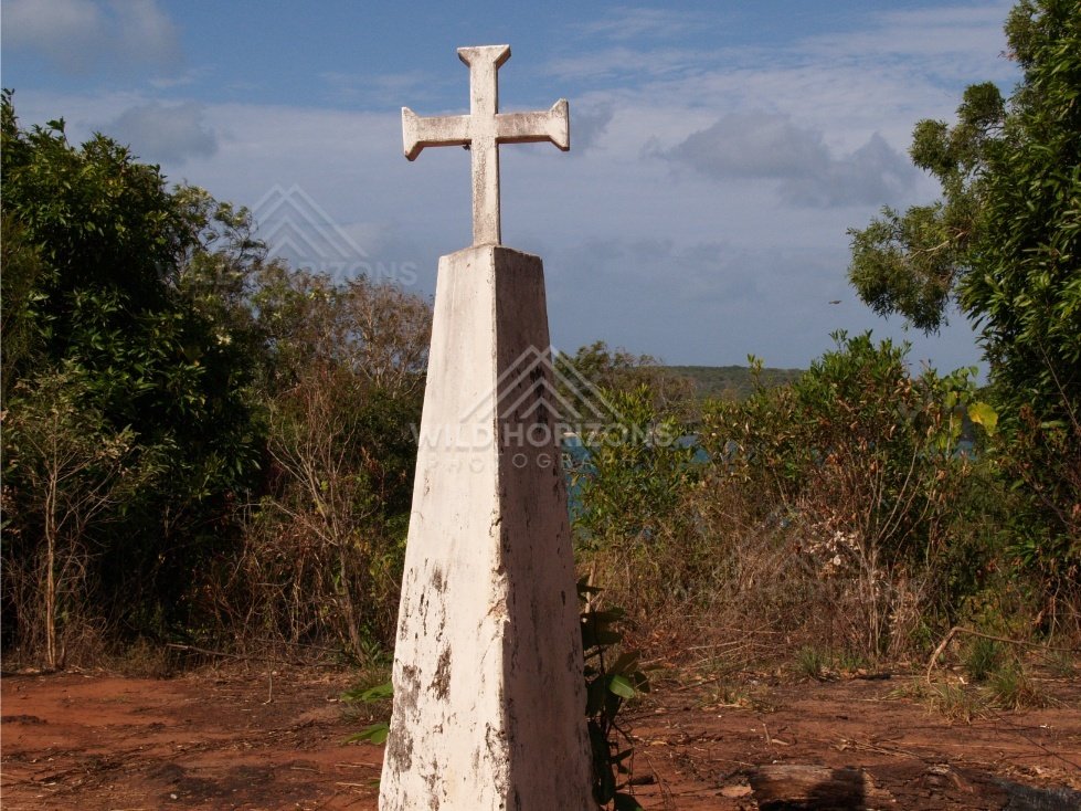 White Memorial Cross Standing Among Coastal Vegetation. Somerset, Australia.