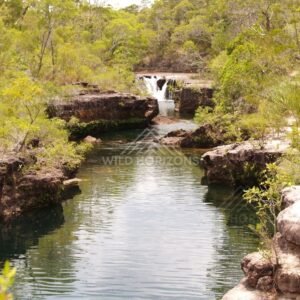 Creek channel with distant falls. Fruitbat Falls, Queensland, Australia.