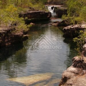 Rock pool with rear waterfall and reflections. Fruitbat Falls, Queensland, Australia.