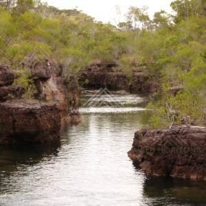 Quiet river reach with sandstone banks. Fruitbat Falls, Queensland, Australia.