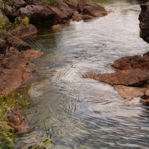 Clear creek winding through rocky gorge. Fruitbat Falls, Queensland, Australia.