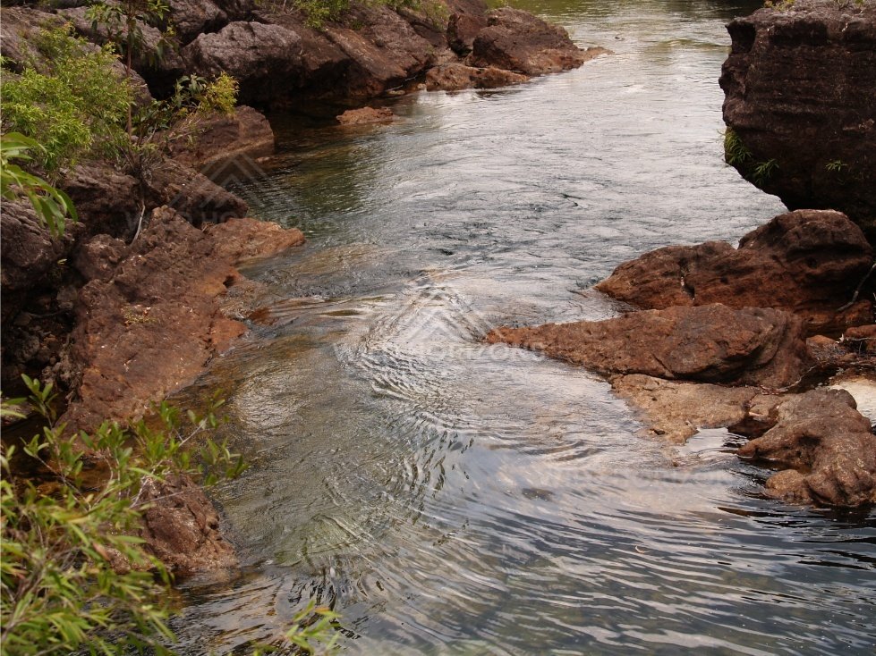 Clear creek winding through rocky gorge. Fruitbat Falls, Queensland, Australia.