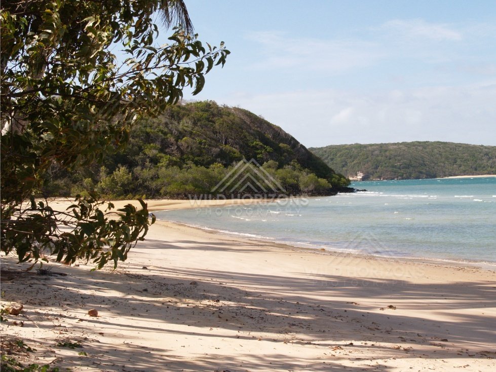 Sheltered Tropical Beach with Calm Water and Forested Headlands. Northern Cape York, Australia.