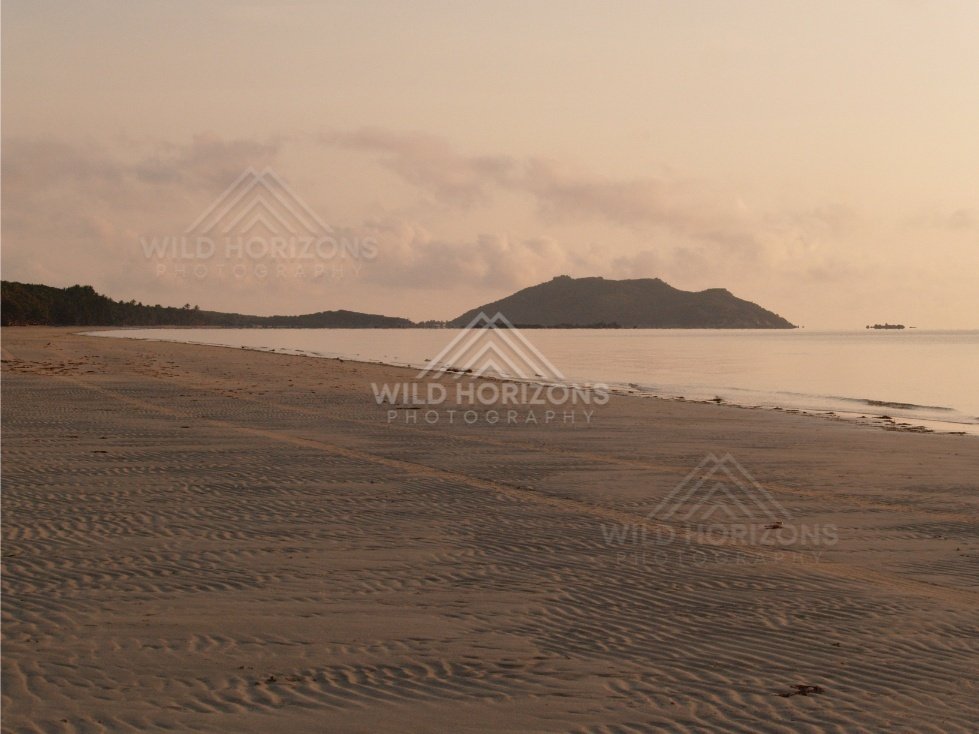 Rippled sand flats leading to a quiet bay in evening light. Portland Roads, Australia.